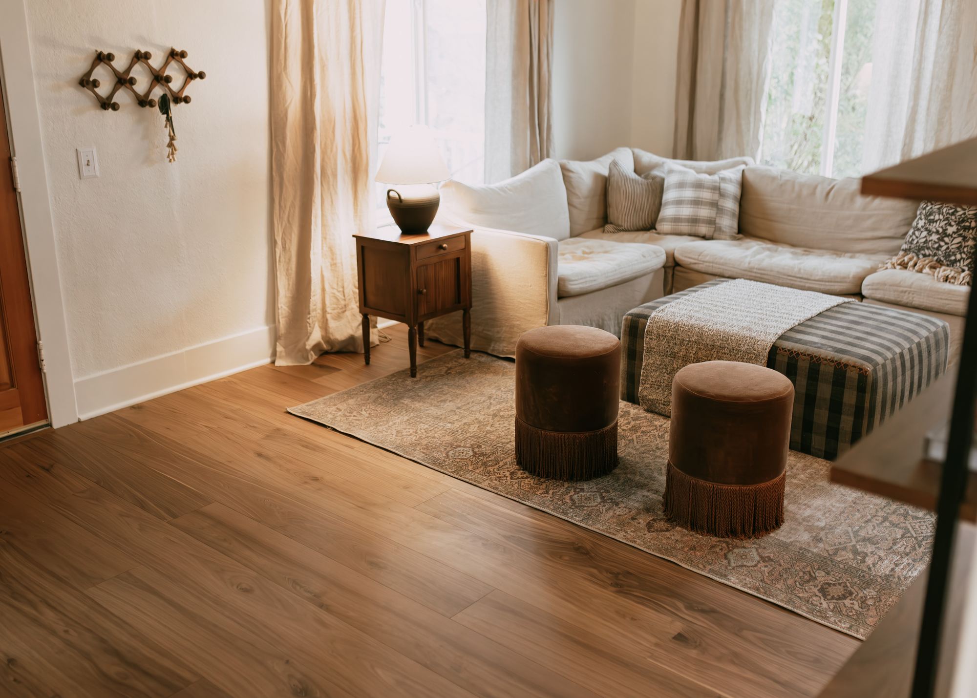 Living room with warm plank flooring installed by Premiere Floors