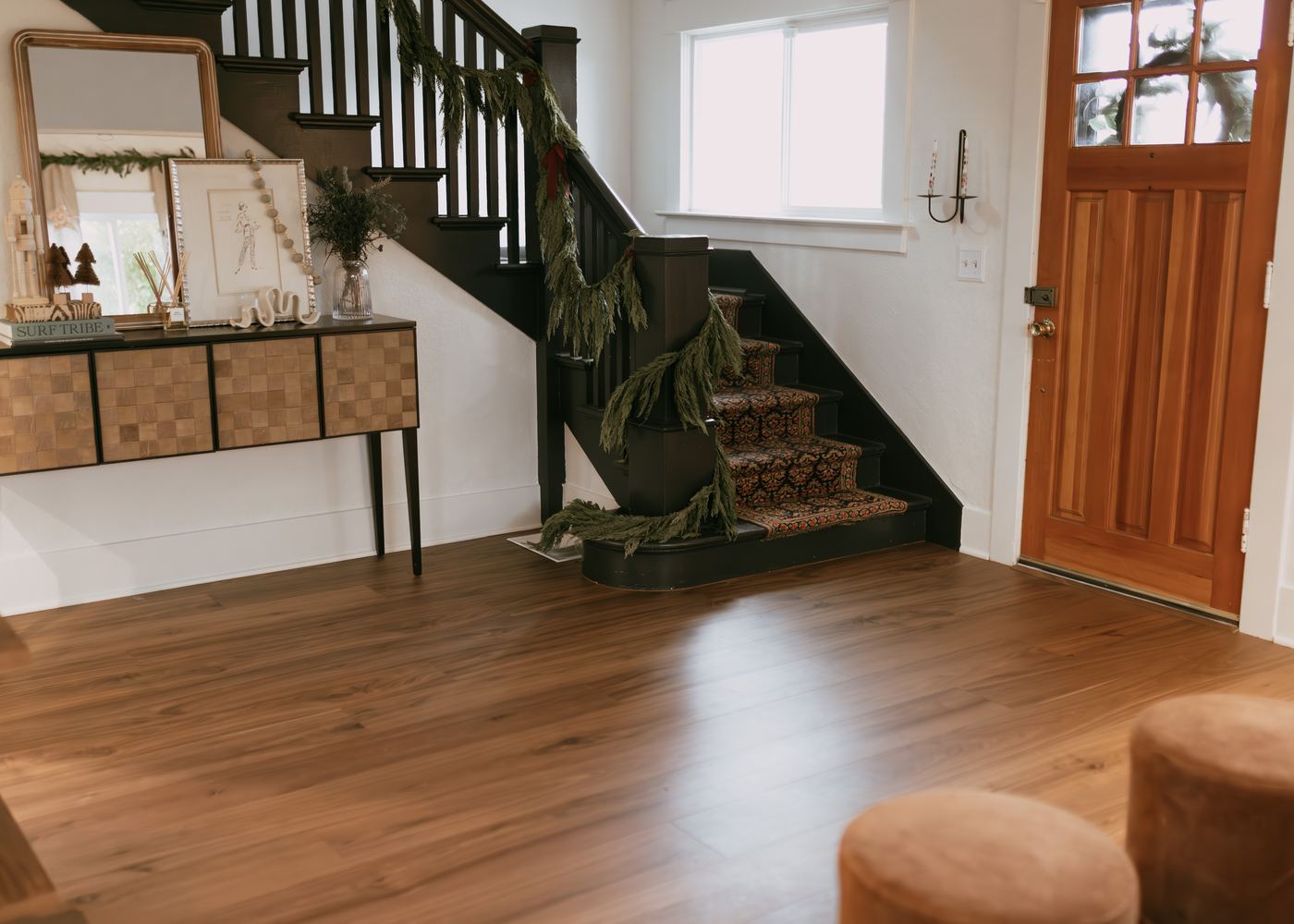 Entry and staircase with warm plank floors