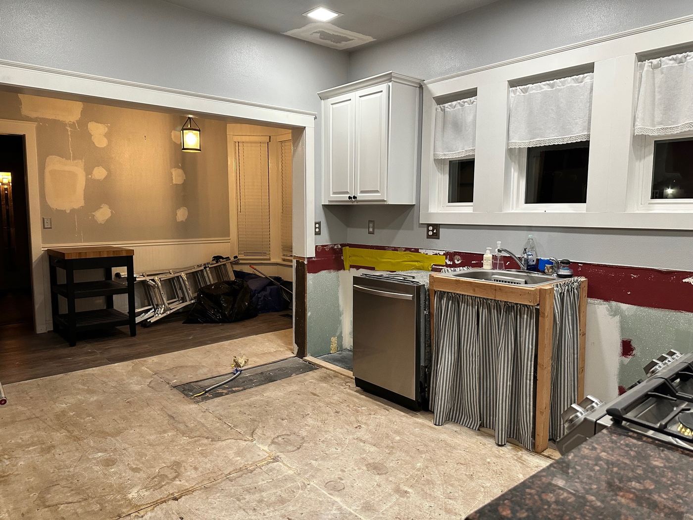 The same kitchen mid-project with floors torn out